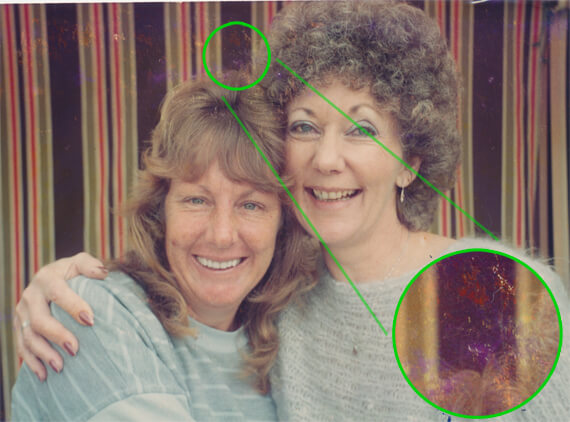 Original, photo of two best friends with a lot of scratches and discoloration.