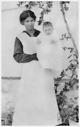 Restored B&W photo of the Nanny holding a child.