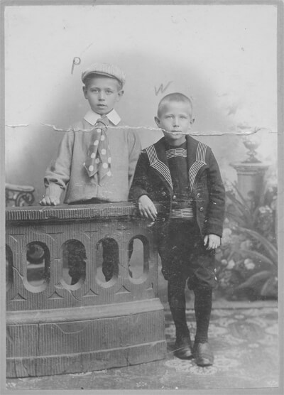 Original, B&W damaged photo of two boys.