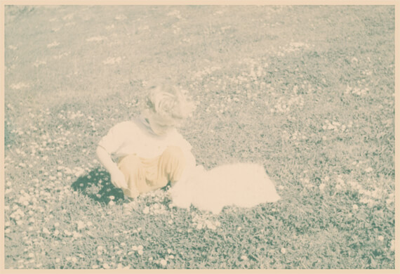 Original, photo of girl and rabbit with very faded colors.