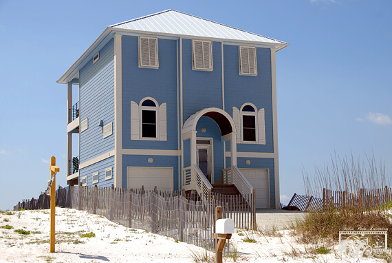 Image of the yellow beach house now turned into a blue beach house.