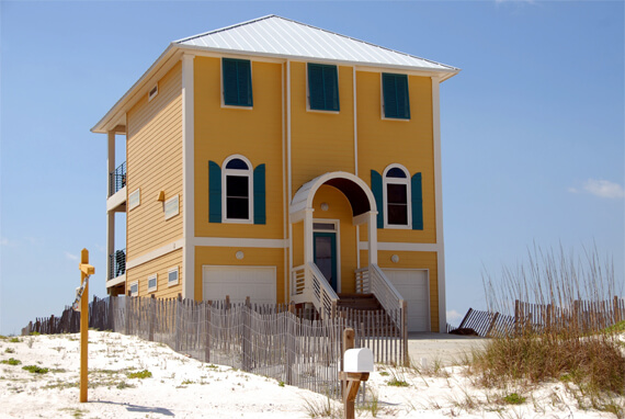 Image of a yellow beach house.